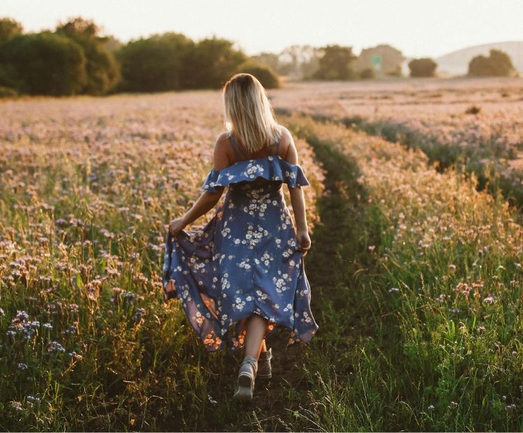 Woman with floral dress in nature